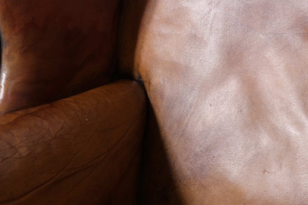 Antica coppia di poltrone wing back o bergere inglese originale in cuoio cognac - Antichità Sale