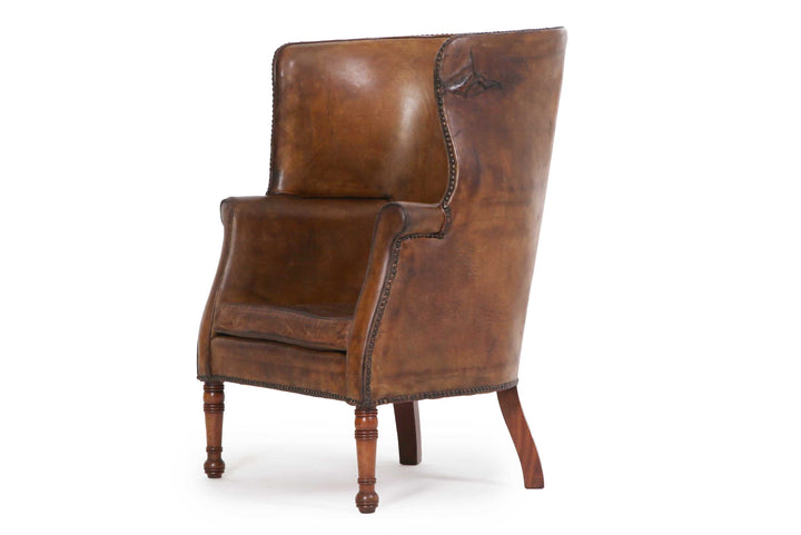 Antica e originale poltrona inglese barrel back marrone cognac