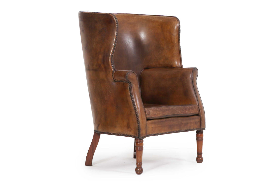 Antica e originale poltrona inglese barrel back marrone cognac