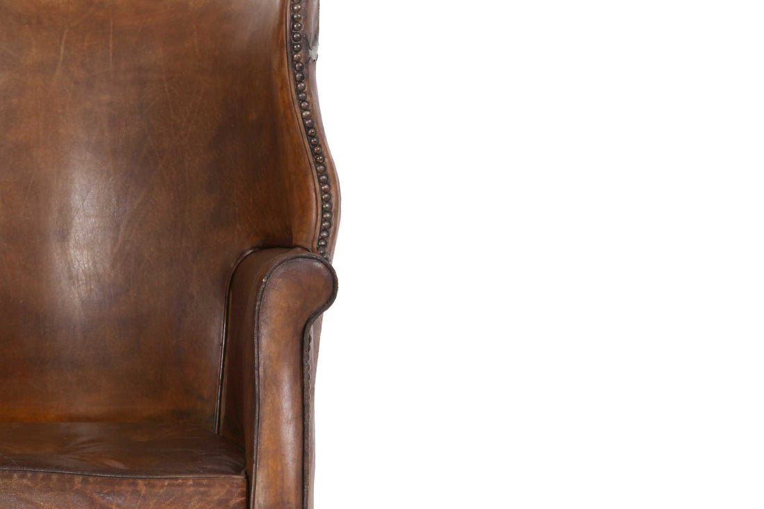 Antica e originale poltrona inglese barrel back marrone cognac