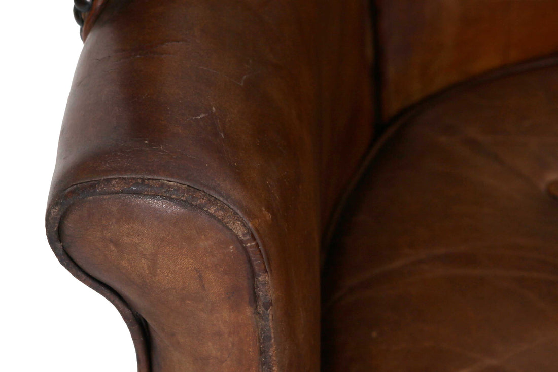 Antica e originale poltrona inglese barrel back marrone cognac