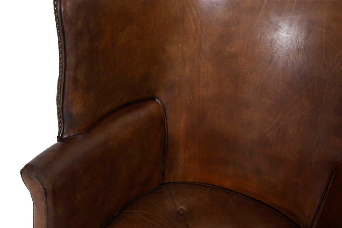 Antica e originale poltrona inglese barrel back marrone cognac