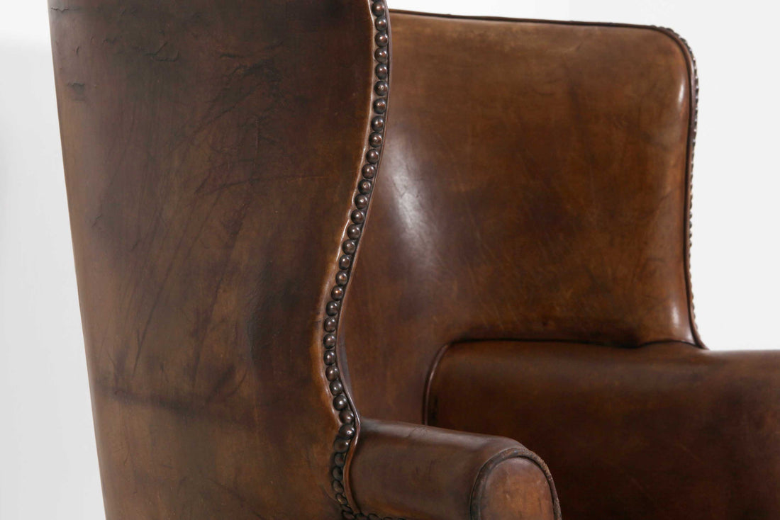 Antica e originale poltrona inglese barrel back marrone cognac